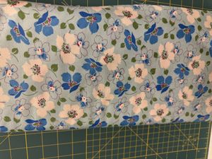 Hovedbilde Blomster p&aring; lys turkis bunn